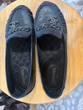 CHANEL Black Quilted Leather Chain-Trim Loafers